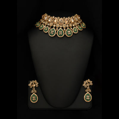 Be your best version with this amazingly designed jewelry. This necklace with minute-detailing done with Polki crystals and green emeralds is all you need to have to grace your presence in a function.Available in Scotland - Edinburgh- Glasgow