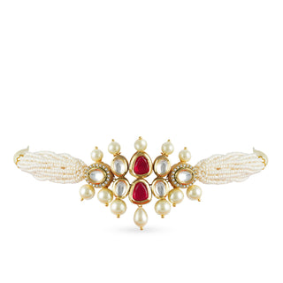 Gold plated kundan choker set with red center and faux pearl.