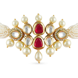 Gold plated kundan choker set with red center and faux pearl.