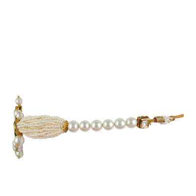 Gold plated kundan choker set with cubic zirconia outline and faux pearl side view.