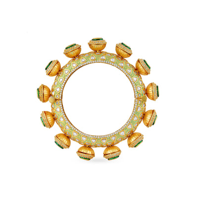 Gold Plated kundan and green meenakari work statement kada with cubic zriconia outline.