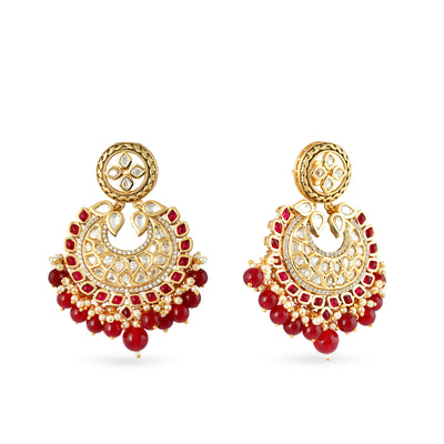 Gold plated kundan necklace set with matchng earrings and red drops.