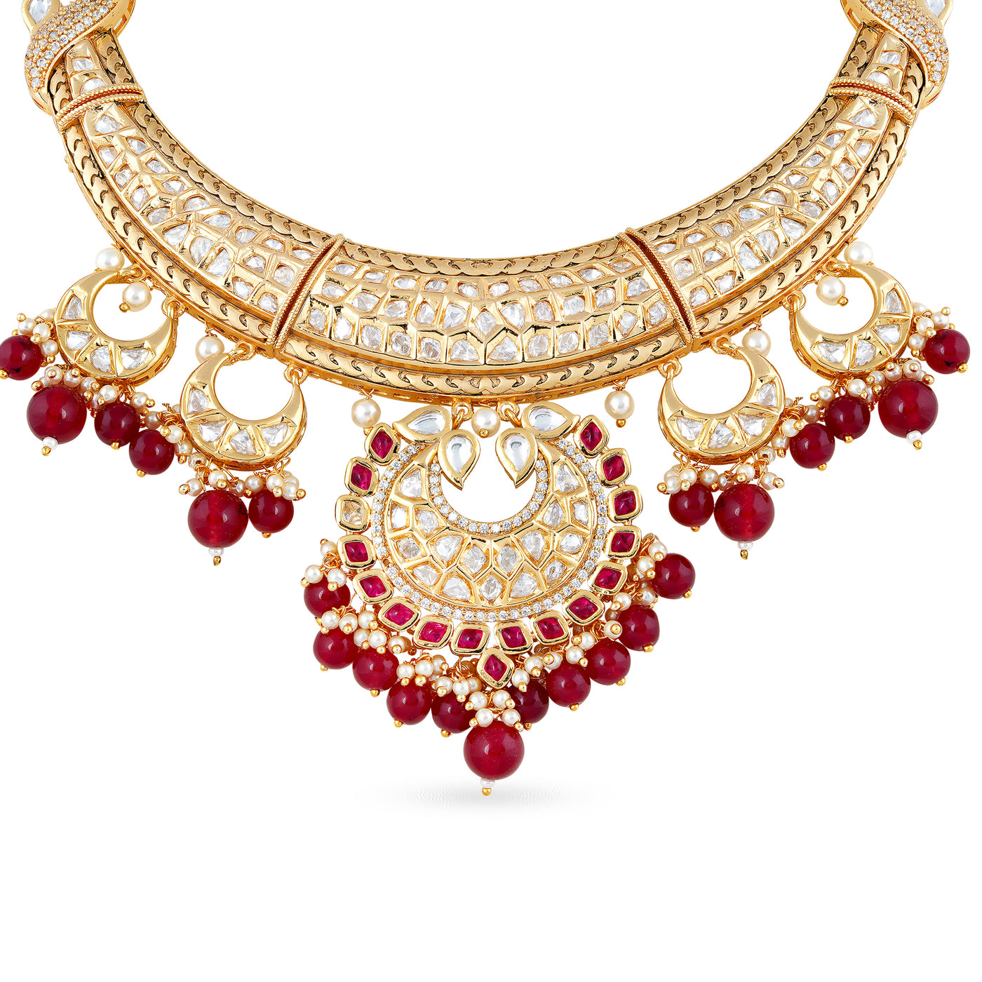 Gold plated kundan necklace set with matchng earrings and red drops.
