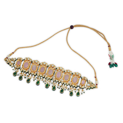 Festive outfit deserves outstanding accessories just like our kundan studden choker set with pearl and green drops.