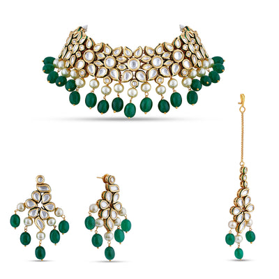 Festive outfit deserves outstanding accessories just like our kundan studden choker set with pearl and green drops.
